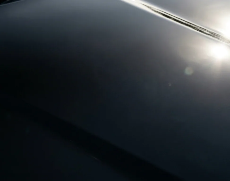 The same bonnet after correction, deep and clear under the lamp