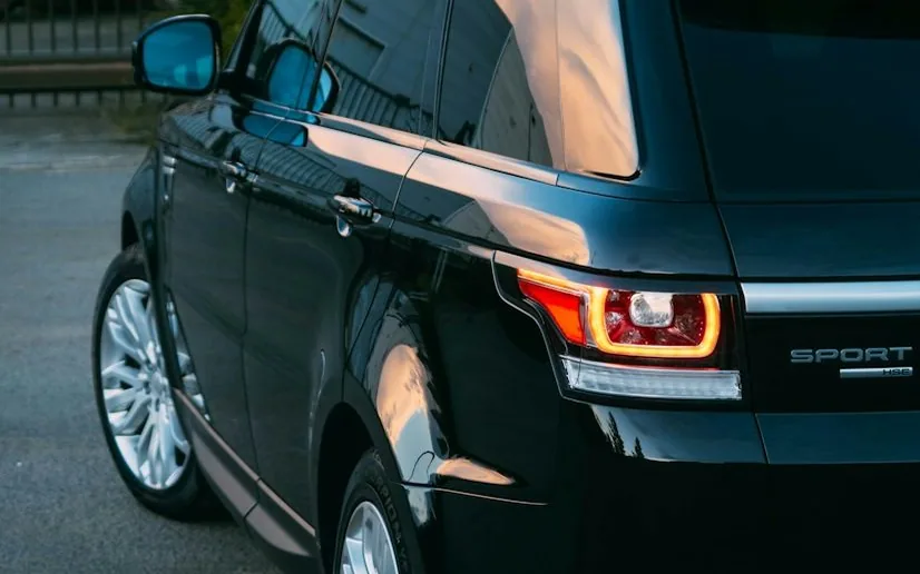 Range Rover Sport — the named car, dark and glossy