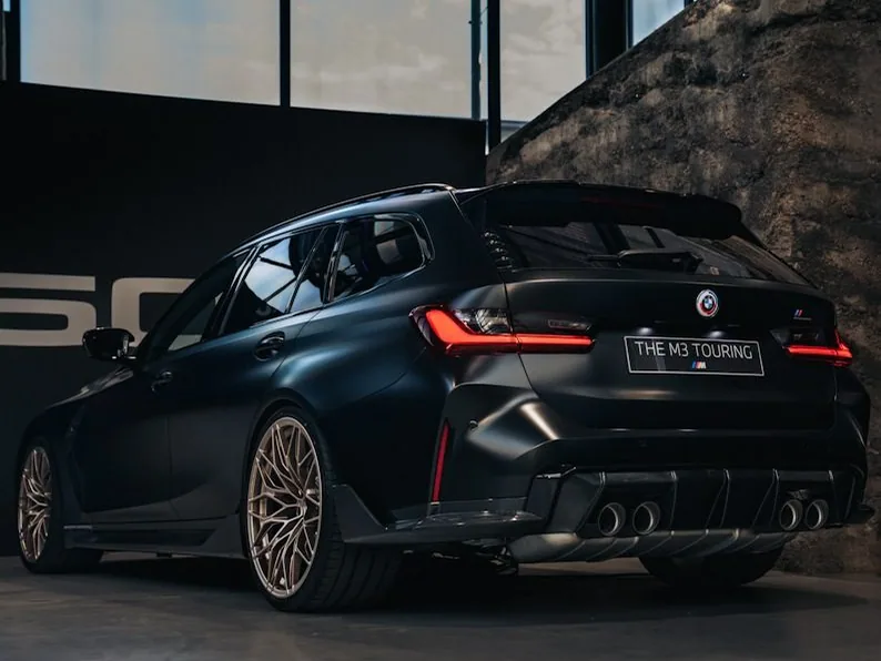 BMW M3 Touring — the named car, dark and glossy